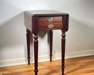 ANTIQUE DROP LEAF SIDE TABLE | Small drop leaf side table with 2 small drawers with brass bulls over spindle carved legs. Leaf length: 7 in. -  l. 18 x w. 14.5 x h. 27 in