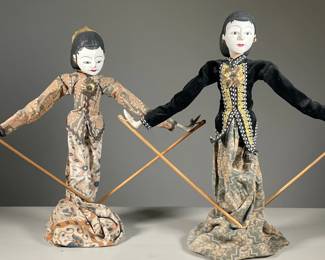 (2PC) INDONESIAN PAINTED WOOD & FABRIC PUPPETS | Each depicting a lady in a long skirt, appliqued jacket and metal earrings. -  l. 6 x w. 18 x h. 16 in (each)