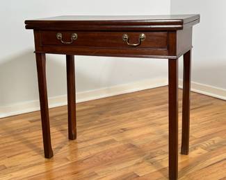 GEORGE III MAHOGANY FLIP-TOP CARD TABLE | 18th century or later oblong fold-over top opening over rear swing leg with drawer with brass bail handles over molded apron. - l. 30 x w. 14 x h. 28.5 in