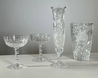 (4PC) CUT CRYSTAL | Including a bud vase, a tapering vase, and two blown and cut champagne coupes. - h. 10 in (tallest)