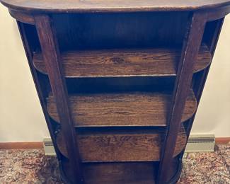 Unique repurposed Oak Victorian shelving unit! This was originally a china cabinet with round red glass on the sides and the door. The door and all the glass are long gone, but it makes an excellent display piece! 