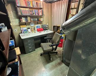 The small basement office has a second STEELCASE desk and chair! Lots OLD books! 