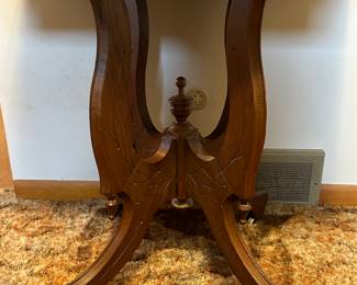 Sweet Victorian side table!  Great condition! Looks to have the original porcelain wheels! 