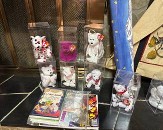 There is nice collection of Beanie Babies, Books and a poster! These were already placed in collectors boxes, the rest are bagged in a tote! 