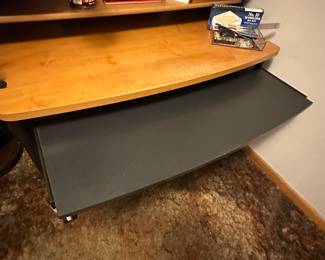 A great contemporary computer desk! Multiple shelves and a pull out keyboard leaf! Very good condition! Lots of office supplies too! 