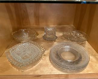 This is a china closet full of assorted vintage clear glass! 