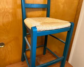 This is a great kitchen stool! Wicker seat and in excellent condition! The color is a great blue/green! I honestly do not think this has ever been used! 