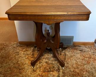 Sweet Victorian side table!  Great condition! Looks to have the original porcelain wheels! 