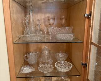 This is a china closet full of assorted vintage clear glass! 