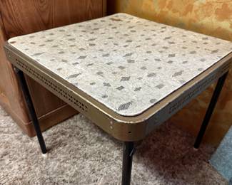 This is honestly something I have never seen at one of our sales - a child size foldable card table. All metal with a fantastic heavy vinyl top in a terrific 1950's/60's pattern! 