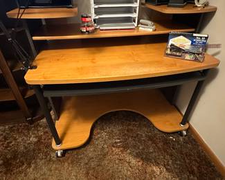 A great contemporary computer desk! Multiple shelves and a pull out keyboard leaf! Very good condition! Lots of office supplies too! 
