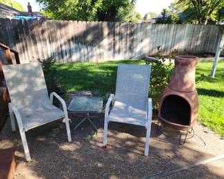 Chiminea and outdoor patio chairs and table