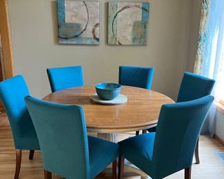 54" round Dining Room Table with 6 black chairs with slipcovers