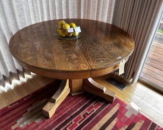 Round oak pedestal table (no leaves)  4'  diameter x 29" H Trifle bowl with a dozen Italian alabaster apples.