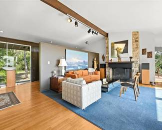 Clean vintage modernist furnishings, rugs, lighting, Richard Stout original artwork over mantle and decor available at this sale. (painting over sofa is not available) 