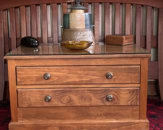 Two drawer chest with hidden compartment and glass top."Looking East" ceramic sculpture by Micheal Poness, 14x 10 inches . Anchor Hocking amber glass ashtray
