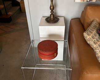 Indian brass oil lamp. 21 inches tall. Orange Burmese lacquer round box. 4" high and 8.5 " across, Tamil lettering, with original label on side, 1920-1930s. Mod chrome, glass top cube, 18.5 square. 