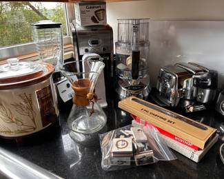 lots more kitchen items, crock pot, blender, coffee pot. 
