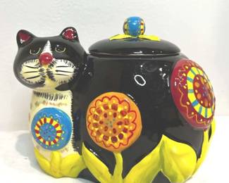 Bright and fun cat character cookie jar. 3 dimensional and hand painted.