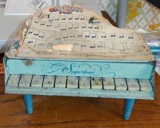 Marx Tin baby grande piano with song book- still plays