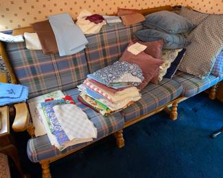 70s couch and plenty of pillows and linens 