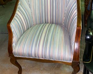 Curved back upholstered chair