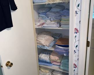 Closet full of sheets and towels
