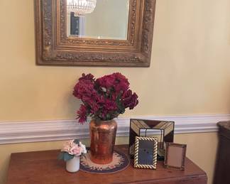 copper vase with artificial flowers