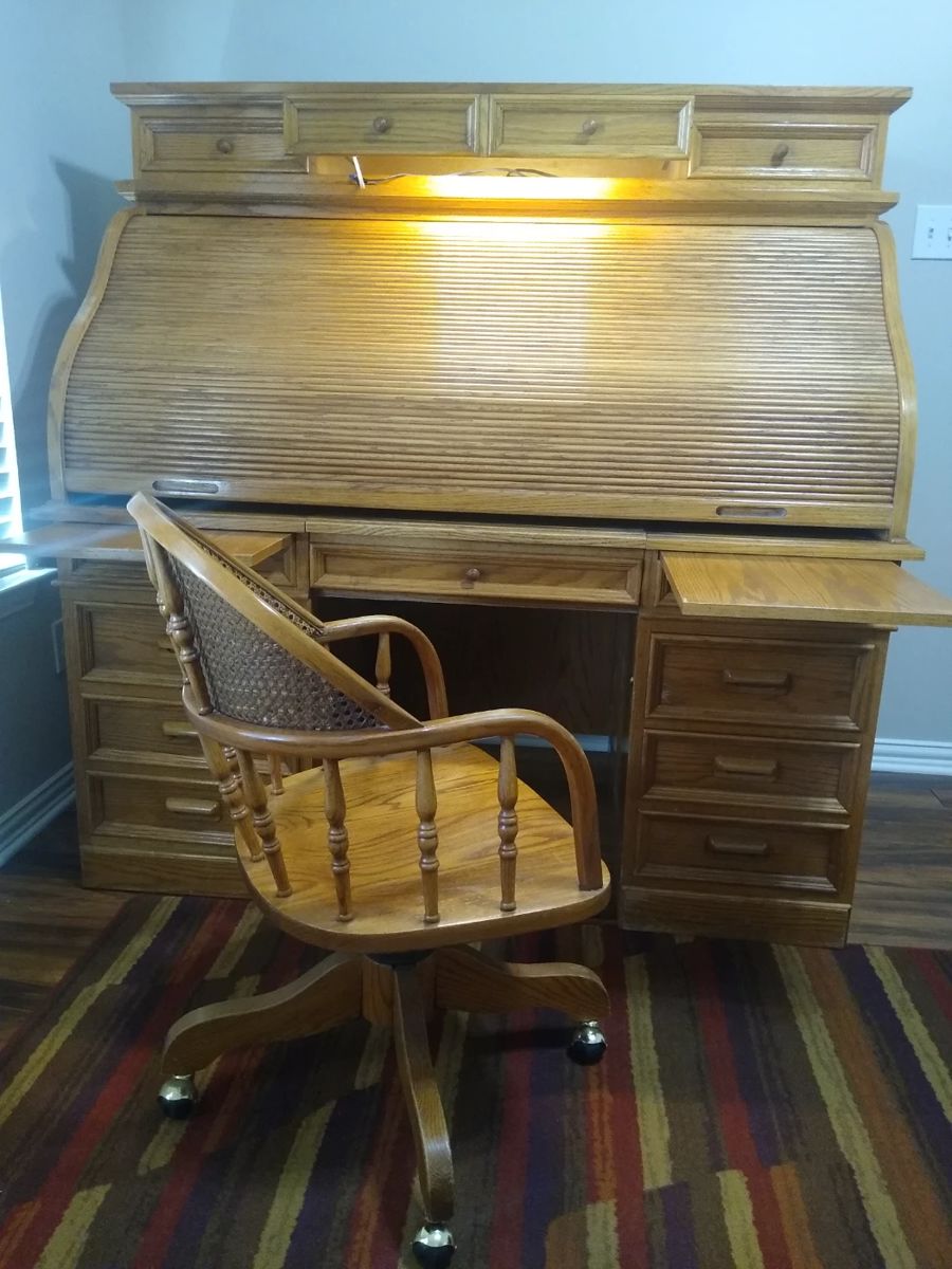 Solid oak, rolltop desk with matching wicker-back chair