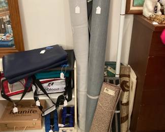 Two Roll of Black Vinyl / Leatherette Fabric; rugs; carry all bags; two white laminate bookshelves.