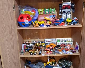 Loads of Kids Toys; Hot Wheels; Ertl; Ozzi the Robot; Baby Shape Game; and so much more... including Storage Cabinets with Shelving & Doors!!