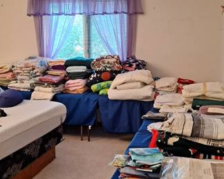 Assorted Linens, including:  Bedding, Table Cloths, Kitchen and Bath Towels, Wash Cloths, Blankets, Sheets; Curtains; Comforter Sets; Decorator Pillows and much more!