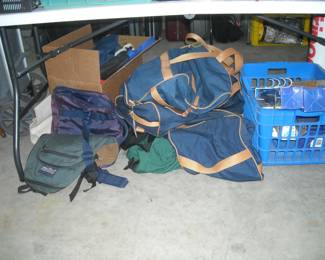 Assorted duffle bags and other carry - ons