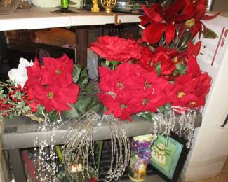 Lota of silk poinsettia flowers and other decorative accents.  Mint condition