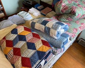 Assorted bedding and quilts
