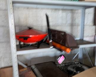 Metal shelf of garage items … sorry -blurry since a chipmunk nearly ran up my leg while taking it!
