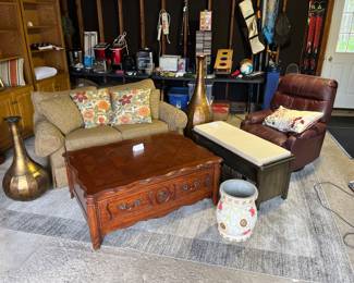 Loveseat, coffee table, leather recliner, three drawer bench and floor art.