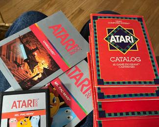 Ms. Pac-Man game with several pieces of Atari literature from 1981 and 82.