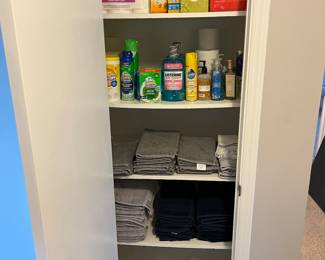 Sets of towels, new bottles of Listerine, cleaning products, toilet paper and tissues.