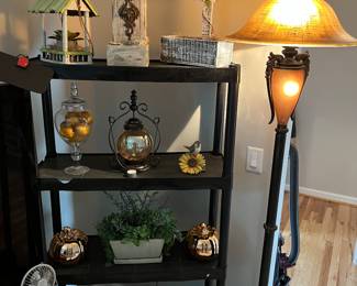 Decorative bird houses and floor lamp.