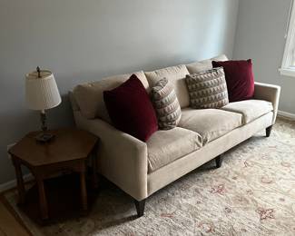 Very clean sofa, octagonal end table and end table lamp.
