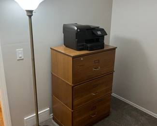 Oak stackable filing cabinet,  HP copier and floor lamp.