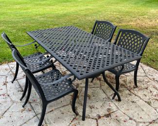 Iron patio table with 4 matching chairs.