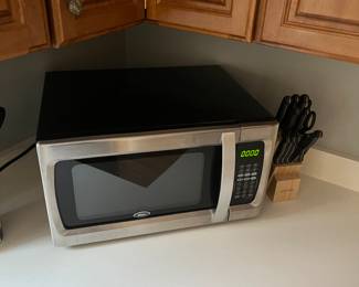 Like new microwave oven and knife set.