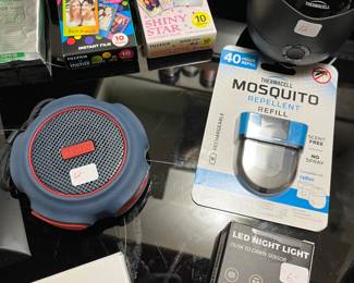 Thermacell Mosquito repeller and repellent refills,  iHome wireless speaker, LED night lights and shark aluminum  wallet.