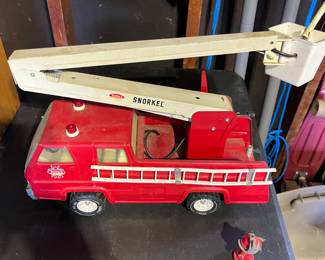 Vintage tin Tonka fire truck with all the accessories.