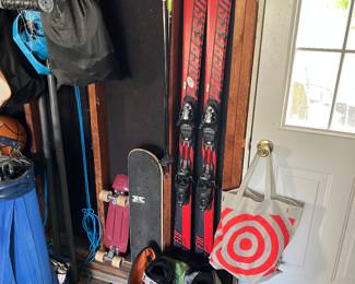 Progressive skis, boots and poles. Two skateboards.