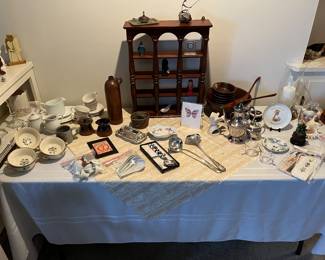 Variety of ceramic dishes, silver plate tea set, soup spoons and wooden salad serving bowl w/ accessories. 
