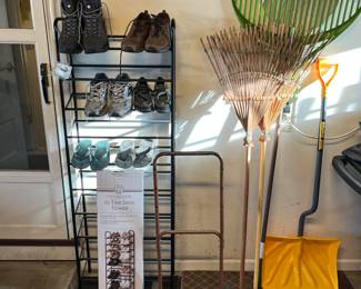 Shoe caddy. Vintage two wheel dolly, rakes and snow shovel.