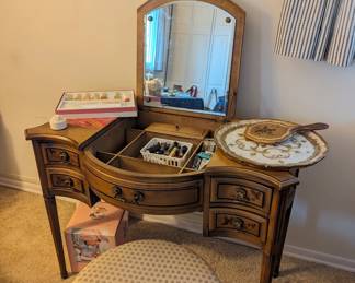 Antique vanity with matching vanity seat.